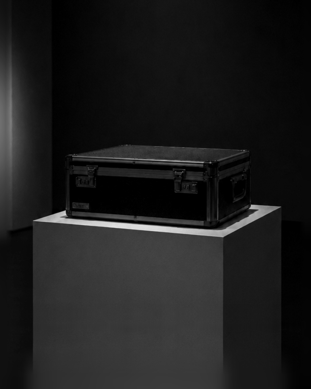 The sealed vault holding I, Uncaptured, lit on a pedestal in a dark room.